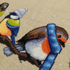 Closeup of Winter Birds cross stitch pattern. Image is zoomed in on the robin. Very cute and very round. The robin is wearing a blue, striped scarf and looks very warm. The robin is facing the wren.